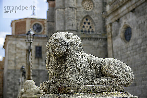 Leon next to the main facade of Cathedral  Avila  Castile and Leon  Spain