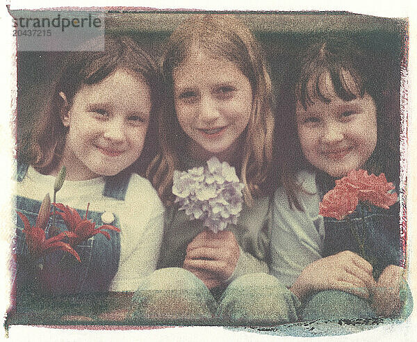 Portrait of children holding flowers. (Polaroid transfer)