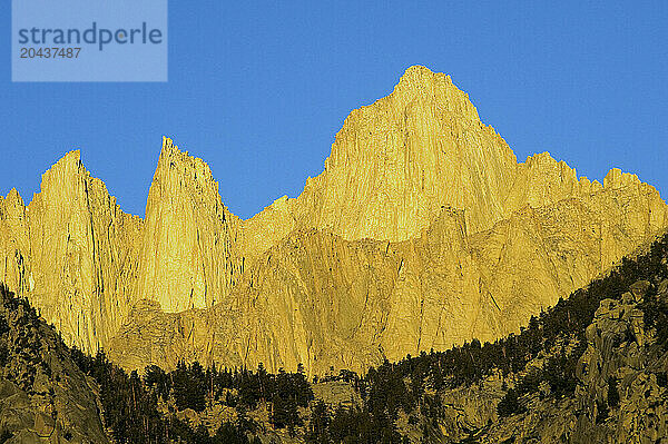 Sunrise light on Mt. Whitney and surrounding peaks.