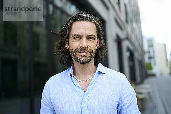 Smiling handsome mature man with stubble