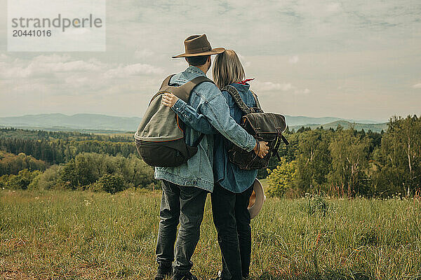 Man and woman enjoying vacation on mountain