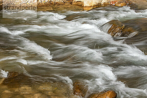 Close-up of water flowing on rocks  long exposure