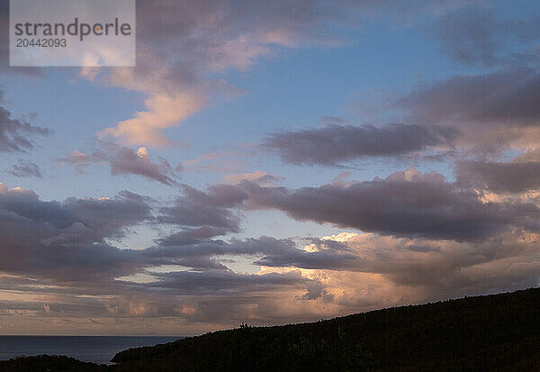 Clouds over sea at sunset