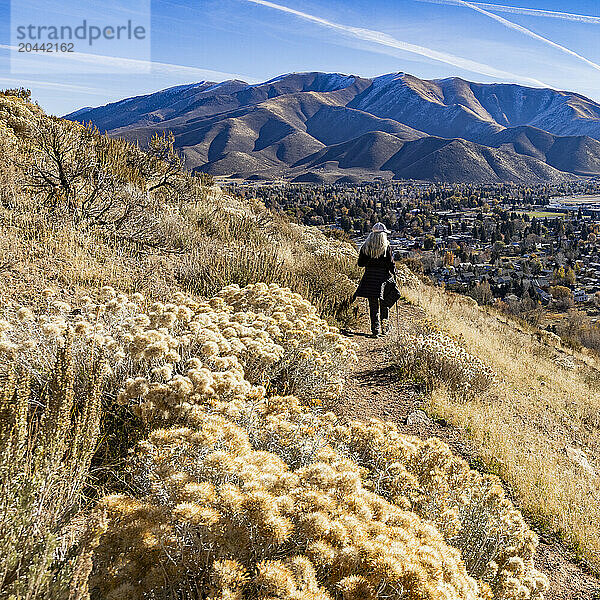 Rear view of woman hiking on Carbonate Mountain trail