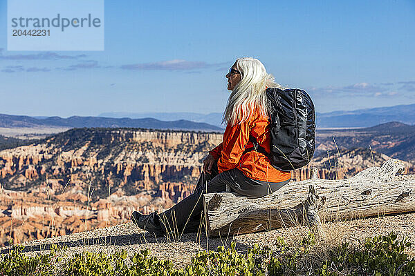 Senior woman with backpack looking at view in Bryce Canyon National Park