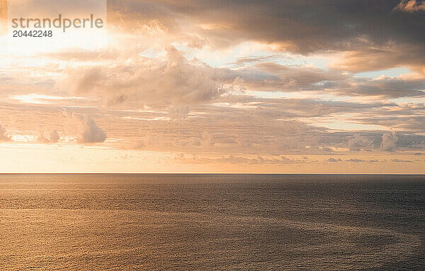 Clouds over sea at sunset