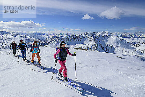 Men and women back country skiing at snowcapped Gressenstein on sunny day  Inneralpbach  Kitzbuehel Alps  Tyrol  Austria