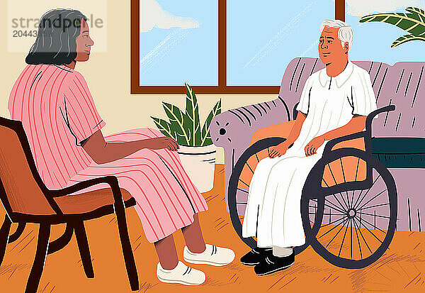 Caregiver discussing with senior man sitting on wheelchair at home