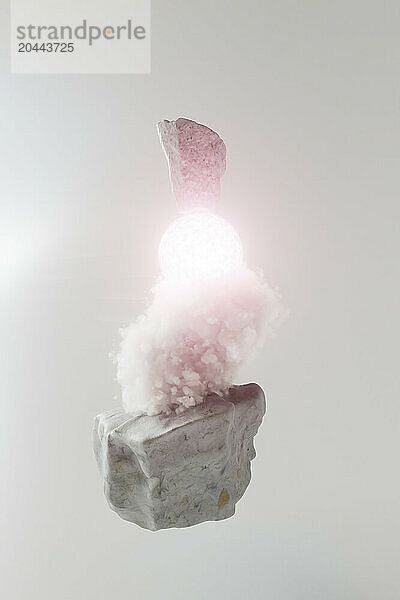 3D render of pink cloud on rock with luminescent sphere against white background