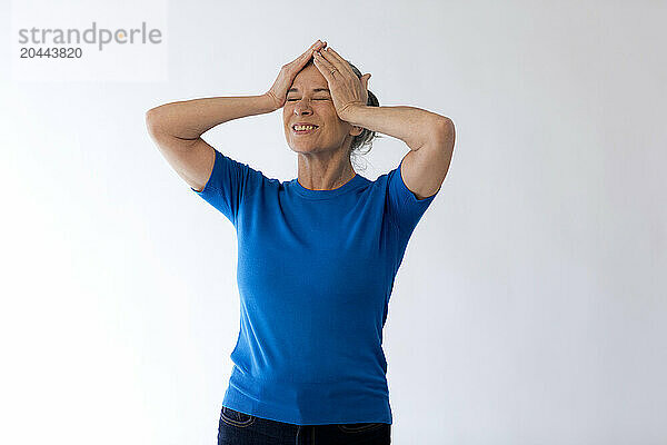 Frustrated woman with head in hands