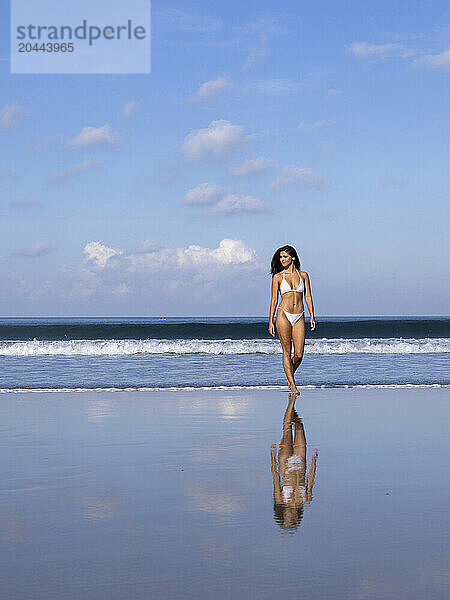 Seductive women walking at beach