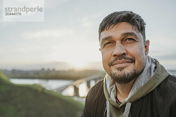 Thoughtful mature man at park