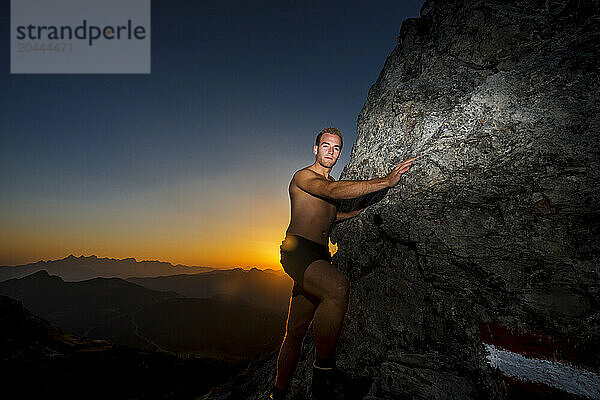 Young hiker climbing Steinfeldspitze rock at Altenmarkt  Zauchensee  Salzburg  Austria