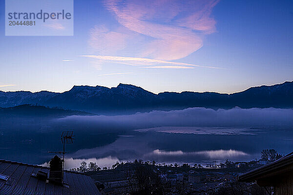 Pergine Valsugana commune with Caldonazzo Lake at dusk in Trento  Italy