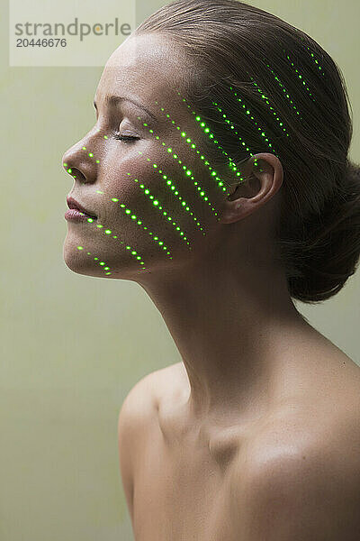 Beauty Portrait of Woman with Laser beam on Face