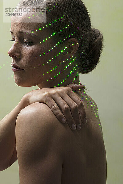 Woman Receiving Laser Therapy on Face and Neck