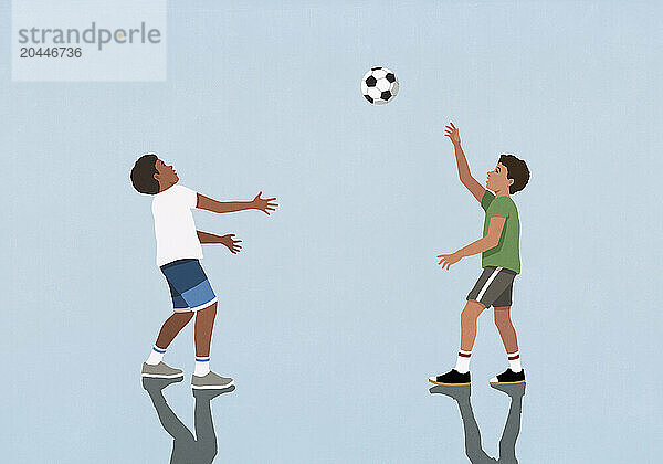 Boy friends playing with soccer ball on blue background