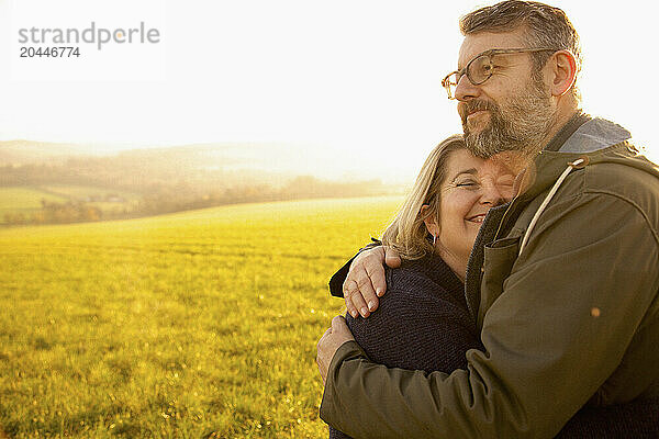 Couple Hugging in a Field