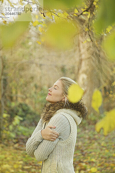 Profile of Young Woman in Autumn Park