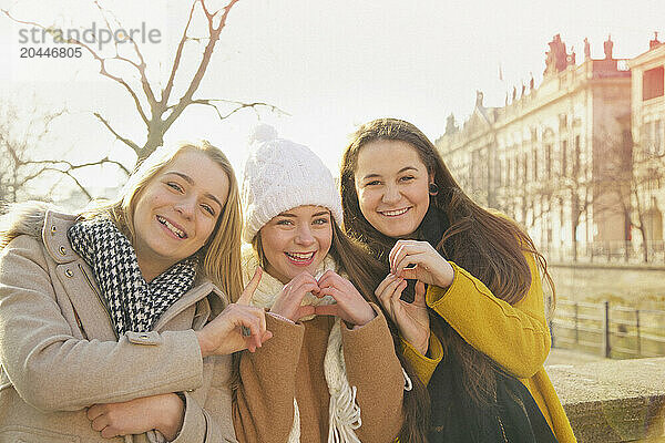 Teenage Girls Gesturing I Love Berlin with Hands