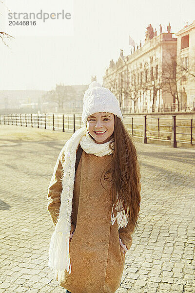 Teenage Girl Wearing Wool Hat and Scarf Smiling  Berlin  Germany