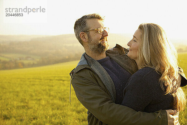 Couple Hugging in a Field