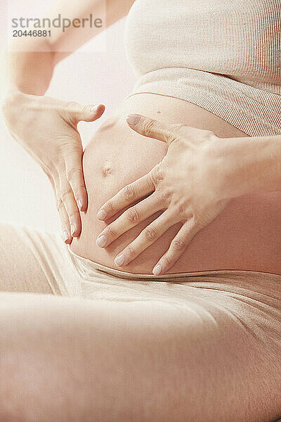 Effleurage Therapeutic Massage  Pregnant Woman Massaging her Stomach