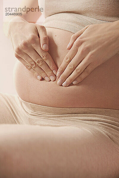 Tapotement Therapeutic Massage  Pregnant Woman Massaging her Stomach