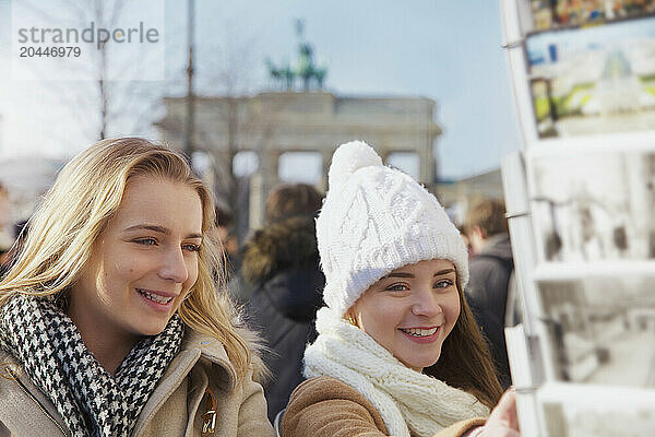 Teenage Girls Browsing Postcards  Berlin  Germany