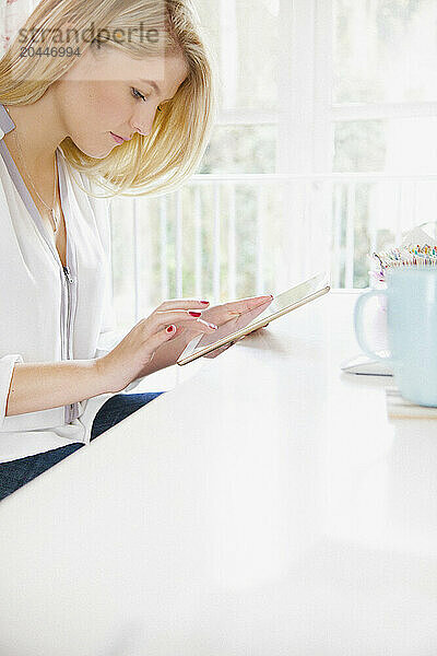 Young Woman Using Tablet Computer