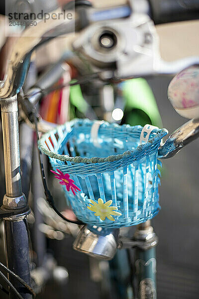 Colorful bike basket attached to handlebars