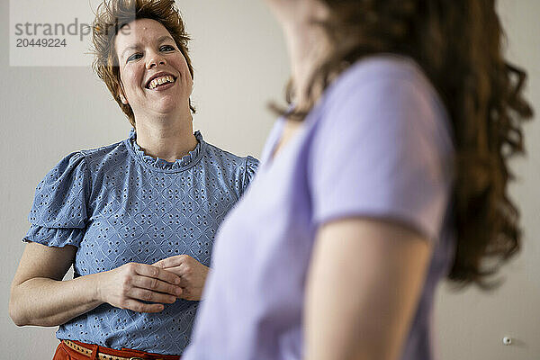 Two women sharing a joyful moment with laughter