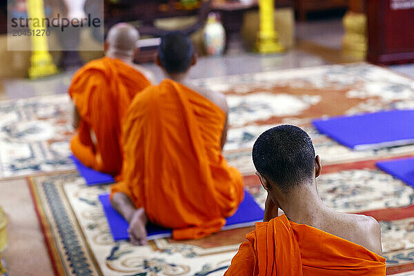 Buddhist monks praying to the Buddha  Munirensay Buddhist Temple  Can Tho  Vietnam  Indochina  Southeast Asia  Asia