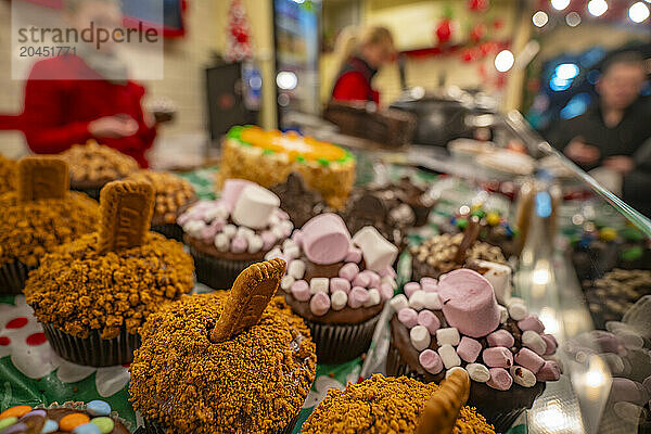 Cakes on Christmas Market stall in Old Market Square at dusk  Nottingham  Nottinghamshire  England  United Kingdom  Europe