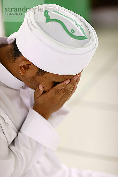 Muslim man praying  Jamiul Azhar Mosque  Vietnam  Indochina  Southeast Asia  Asia