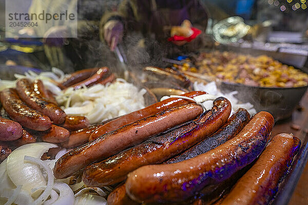 Frankfurter sausages on Christmas Market stall in Old Market Square at dusk  Nottingham  Nottinghamshire  England  United Kingdom  Europe