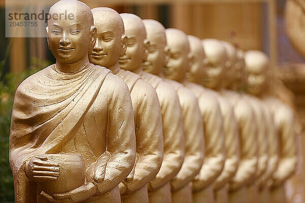 Statues showing Sangha with offering bowls (Alms for Buddhists monks)  Mongkol Serei Kien Khleang Pagoda  Phnom Penh  Cambodia  Indochina  Southeast Asia  Asia