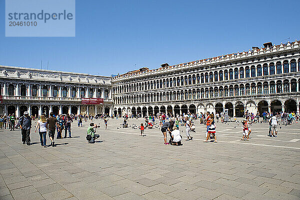 View of the Piazza de San Marco (St. Mark's Square)  facing the Basilica of San Marco (St. Mark's Basilica) with the Procuratorie Vecchie stretching to the right and the Correr Museum on left  Venice  UNESCO World Heritage Site  Veneto  Italy  Europe