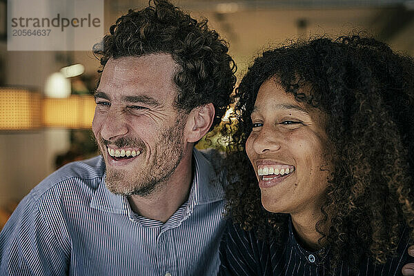 Cheerful couple enjoying in cafe