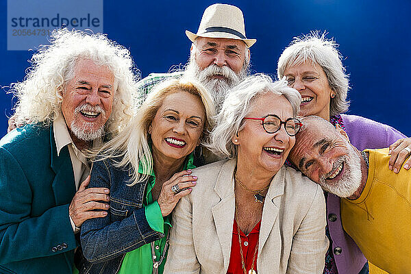 Group of cheerful senior friends enjoying together