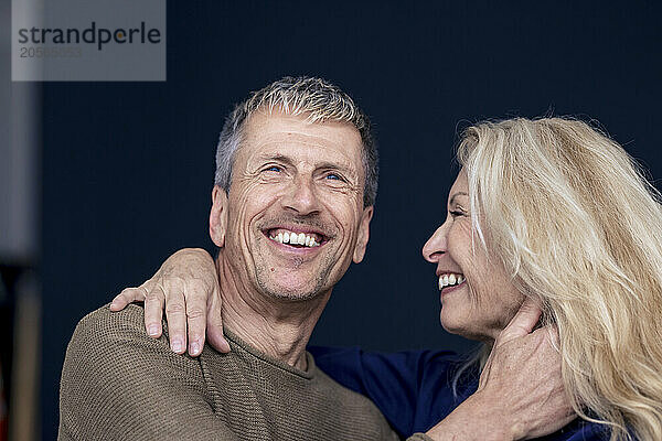 Cheerful senior couple at home