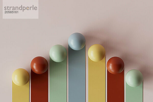 3D render of multi colored graph bars with spheres against pink background