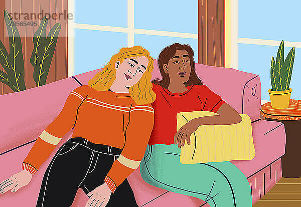 Woman leaning on friend and sitting on sofa at home