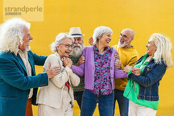 Playful senior friends having fun together