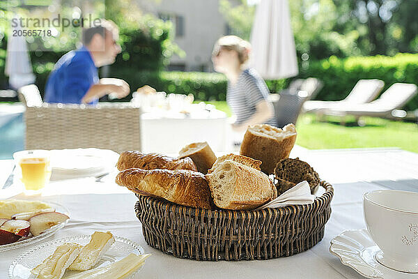 Basket of fresh breads on dining table