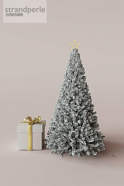 3D render of Christmas tree with gift against pink background