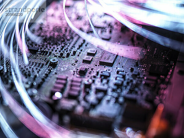 Illuminated fiber optics on mother board of laptop computer