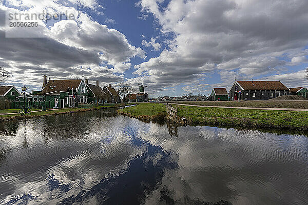 Zaanse Schans windmills near Amsterdam under cloudy sky