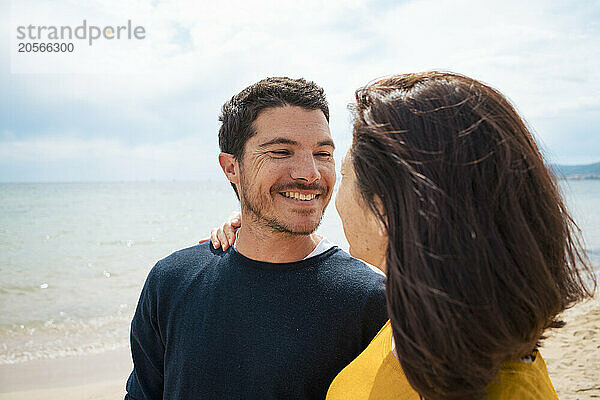 Happy man and woman at beach