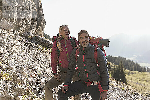 Happy mature couple standing on mountain of Tyrol in Austria